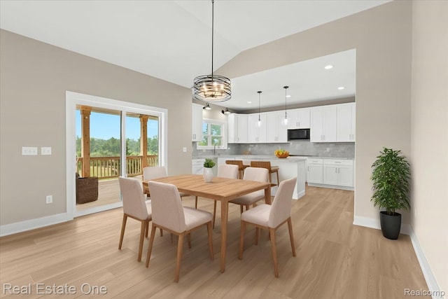 2763 Clivedon Rd, Howell, MI 48843 - dining space featuring light wood-style floors, baseboards, a chandelier, and recessed lighting
