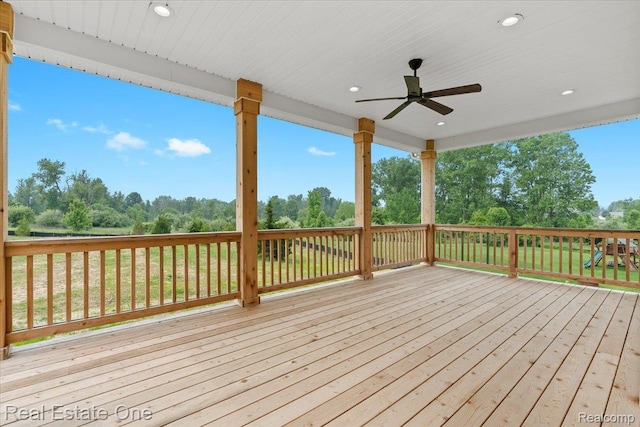 2763 Clivedon Rd, Howell, MI 48843 - wooden deck featuring ceiling fan and view of wooded area