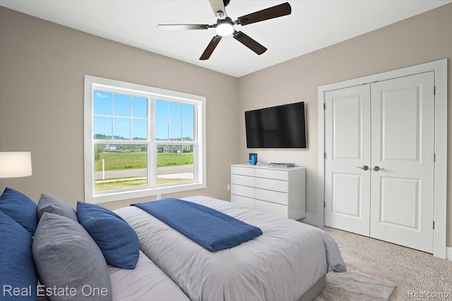 2763 Clivedon Rd, Howell, MI 48843 - bedroom featuring light carpet, a ceiling fan, and a closet
