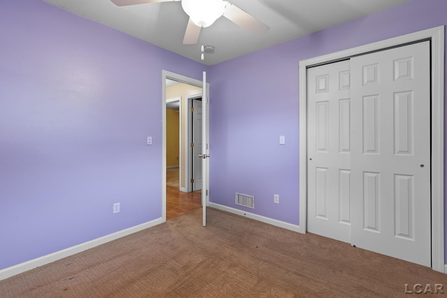 345 Alexander Dr, Adrian, MI 49221 - unfurnished bedroom featuring carpet, baseboards, a closet, and a ceiling fan