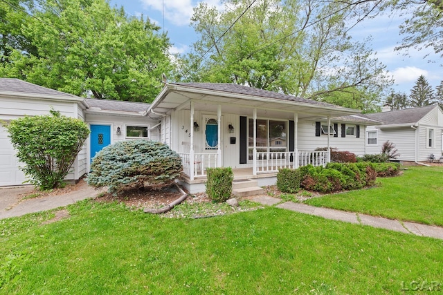 345 Alexander Dr, Adrian, MI 49221 - view of front of house with a porch, an attached garage, and a front lawn