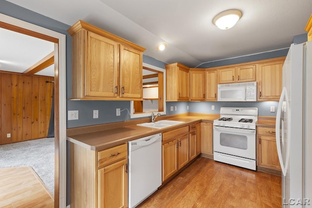 345 Alexander Dr, Adrian, MI 49221 - kitchen featuring white appliances, a sink, light wood finished floors, and vaulted ceiling