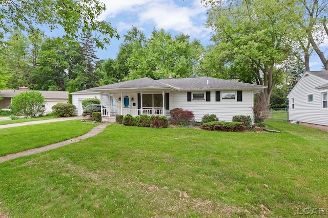 345 Alexander Dr, Adrian, MI 49221 - single story home featuring a porch, a front yard, and a garage
