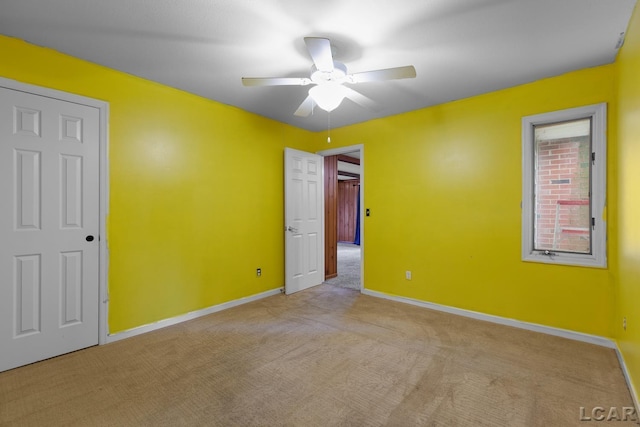 345 Alexander Dr, Adrian, MI 49221 - unfurnished bedroom featuring carpet, baseboards, and a ceiling fan