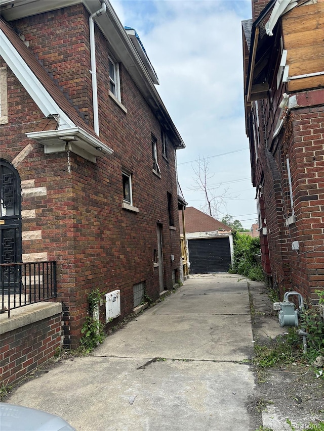 3260 Waverly St, Detroit, MI 48238 - view of home's exterior featuring brick siding and an outbuilding