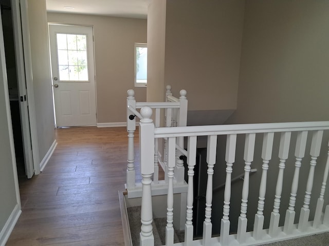 243 Lake Dr, Muskegon, MI 49441 - stairway with wood-type flooring and baseboards