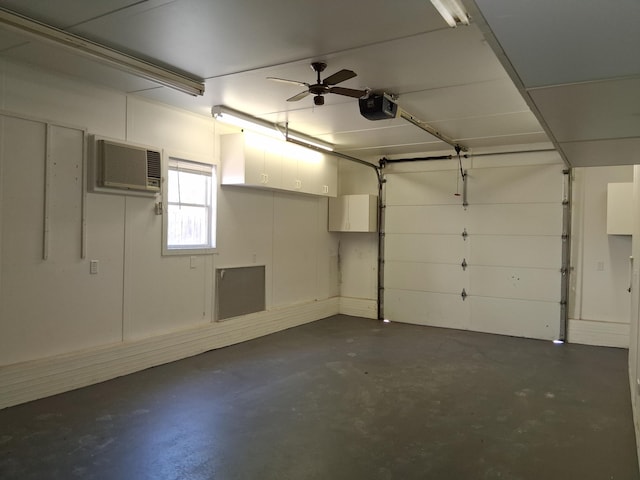 243 Lake Dr, Muskegon, MI 49441 - garage with a garage door opener, an AC wall unit, and ceiling fan