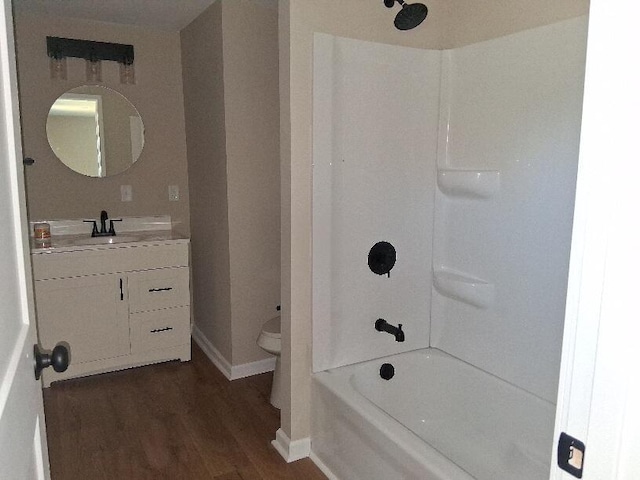 243 Lake Dr, Muskegon, MI 49441 - bathroom with vanity, wood finished floors, and shower / washtub combination