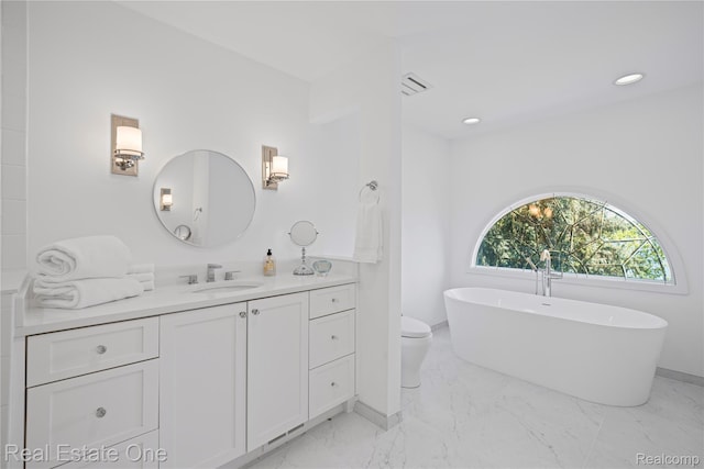 3856 Pine Lake Knoll Dr, West Bloomfield, MI 48324 - bathroom featuring vanity, marble finish flooring, a freestanding bath, recessed lighting, and toilet