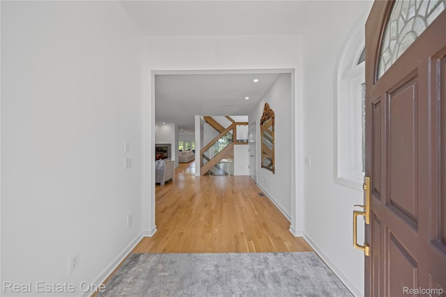 3856 Pine Lake Knoll Dr, West Bloomfield, MI 48324 - foyer entrance with baseboards, stairway, light wood-style flooring, and recessed lighting