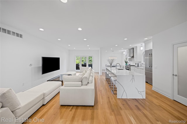 3856 Pine Lake Knoll Dr, West Bloomfield, MI 48324 - living room featuring light wood-type flooring and recessed lighting