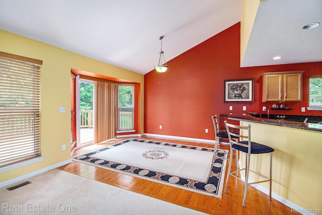 1130 Andover Cir, Commerce Twp, MI 48390 - kitchen featuring baseboards, dark countertops, plenty of natural light, light wood finished floors, and recessed lighting