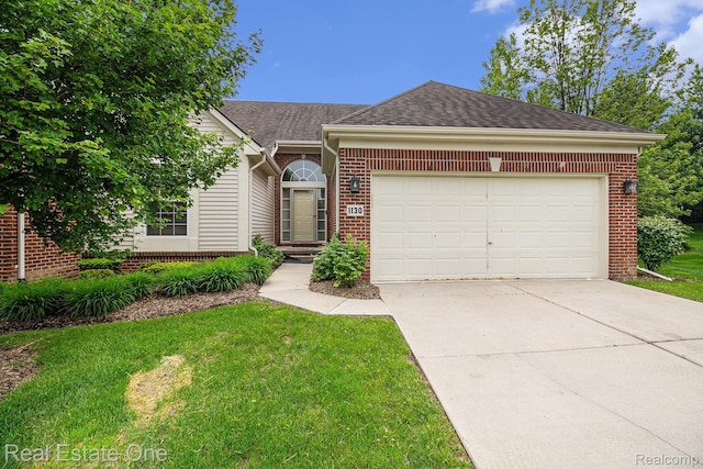 1130 Andover Cir, Commerce Twp, MI 48390 - ranch-style home with brick siding, an attached garage, driveway, a shingled roof, and a front yard