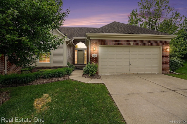 1130 Andover Cir, Commerce Twp, MI 48390 - ranch-style home featuring brick siding, driveway, a garage, a shingled roof, and a yard