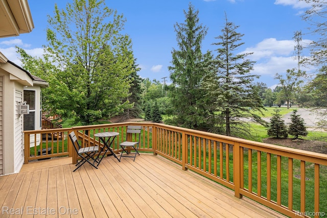 1130 Andover Cir, Commerce Twp, MI 48390 - wooden terrace featuring view of scattered trees