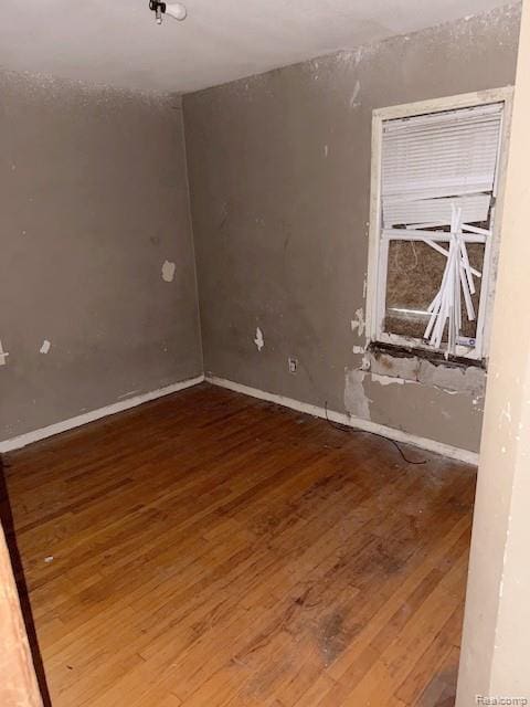 19537 Hamburg St, Detroit, MI 48205 - spare room featuring wood-type flooring and baseboards