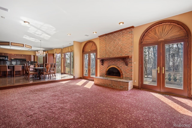 5148 Crest Knls, Bloomfield Hills, MI 48302 - unfurnished living room with french doors, a chandelier, carpet floors, recessed lighting, and baseboards