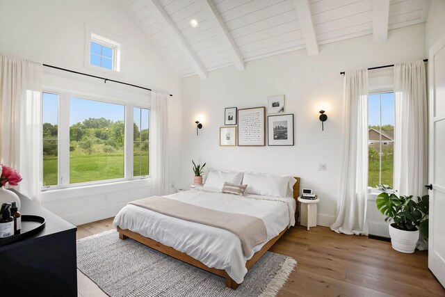 2958 S Edgar Rd, Mason, MI 48854 - bedroom featuring wood-type flooring, baseboards, high vaulted ceiling, and wood ceiling with exposed beams