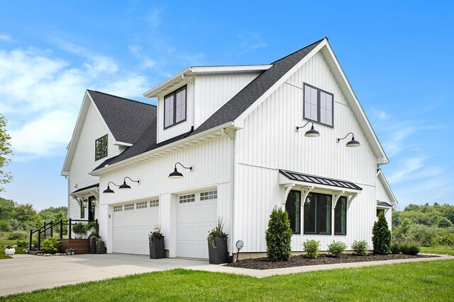 2958 S Edgar Rd, Mason, MI 48854 - view of property exterior with driveway, an attached garage, a shingled roof, a standing seam roof, and a yard
