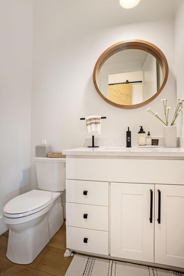 2958 S Edgar Rd, Mason, MI 48854 - bathroom featuring toilet and vanity