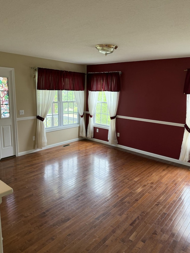 12 Picardy Pl, Hillsdale, MI 49242 - spare room featuring healthy amount of natural light, baseboards, and hardwood / wood-style floors