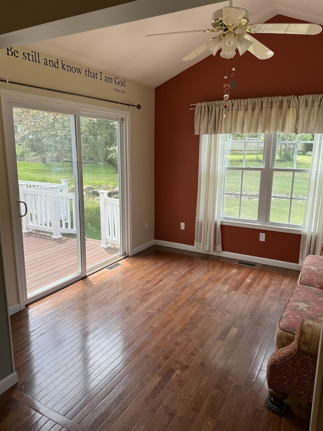 12 Picardy Pl, Hillsdale, MI 49242 - unfurnished living room featuring vaulted ceiling, hardwood / wood-style flooring, baseboards, and ceiling fan