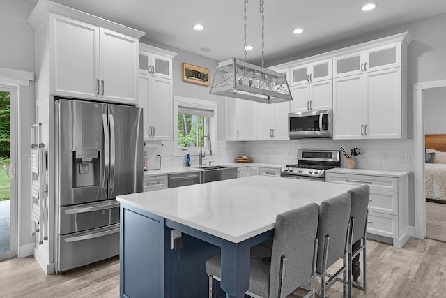 1304 Michillinda Rd, Muskegon, MI 49445 - kitchen featuring stainless steel appliances, healthy amount of natural light, light wood-style flooring, and recessed lighting