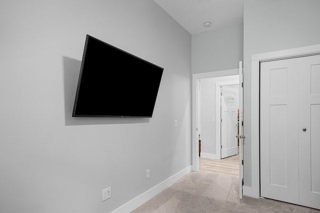 1304 Michillinda Rd, Muskegon, MI 49445 - unfurnished bedroom featuring light carpet, baseboards, and a closet