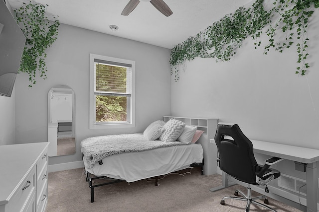 1304 Michillinda Rd, Muskegon, MI 49445 - bedroom featuring light carpet, an office area, a ceiling fan, and arched walkways