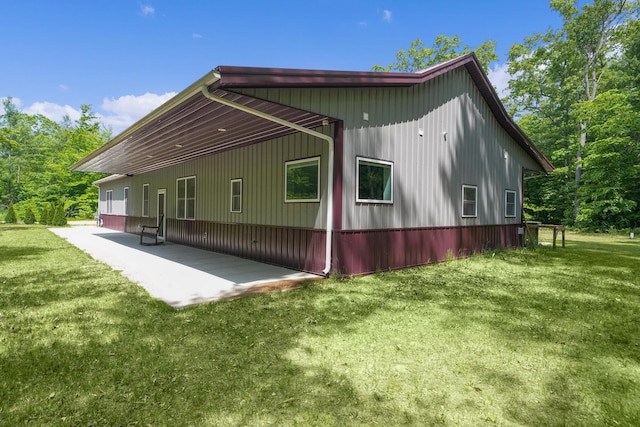 1304 Michillinda Rd, Muskegon, MI 49445 - view of home's exterior featuring a lawn and a patio area