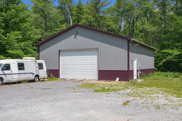 1304 Michillinda Rd, Muskegon, MI 49445 - detached garage featuring view of wooded area