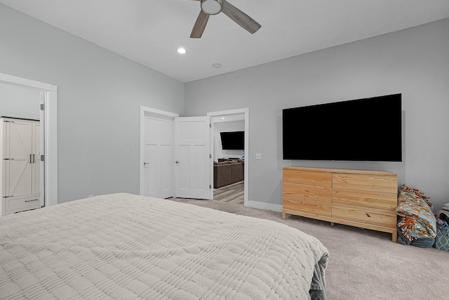 1304 Michillinda Rd, Muskegon, MI 49445 - bedroom with light colored carpet, recessed lighting, a ceiling fan, and ensuite bathroom