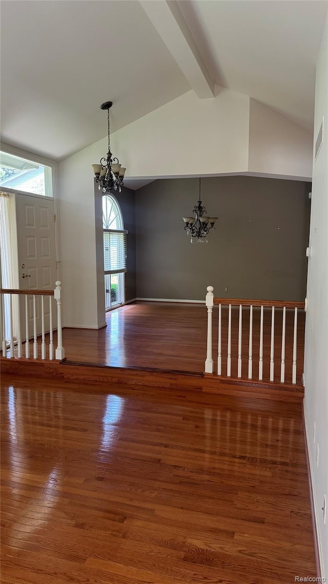 413 Covington Ct Unit 81, Northville, MI 48168 - unfurnished room featuring a chandelier and wood finished floors