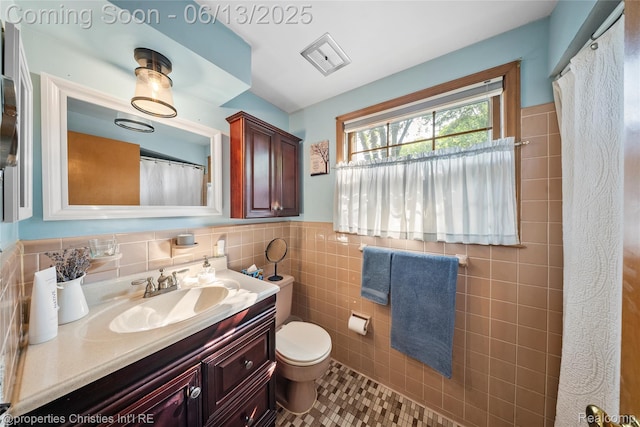 713 Claremont St, Dearborn, MI 48124 - bathroom with vanity, tile walls, wainscoting, tile patterned floors, and a shower with curtain