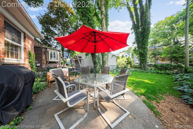 713 Claremont St, Dearborn, MI 48124 - view of patio / terrace featuring outdoor dining space and a grill