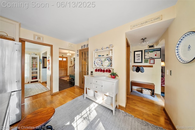 713 Claremont St, Dearborn, MI 48124 - hallway with light wood-style floors and baseboards