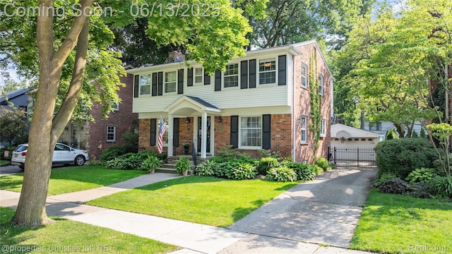 713 Claremont St, Dearborn, MI 48124 - colonial house featuring brick siding and a detached garage
