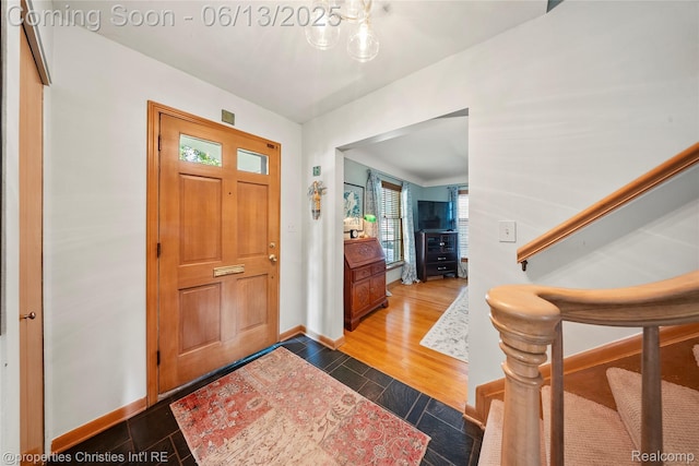 713 Claremont St, Dearborn, MI 48124 - entryway featuring stairs and wood finished floors