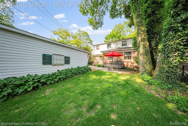 713 Claremont St, Dearborn, MI 48124 - view of green lawn featuring a patio