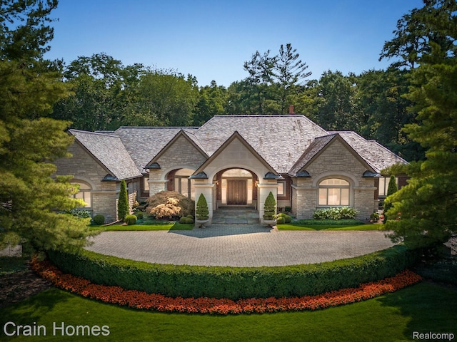 20 Hidden Rdg, Bloomfield Hills, MI 48304 - french country home with stone siding, a front lawn, and a high end roof