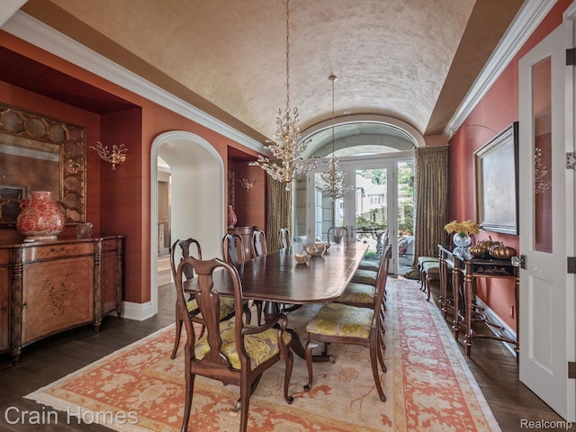 20 Hidden Rdg, Bloomfield Hills, MI 48304 - dining space featuring lofted ceiling, arched walkways, baseboards, wood finished floors, and a chandelier