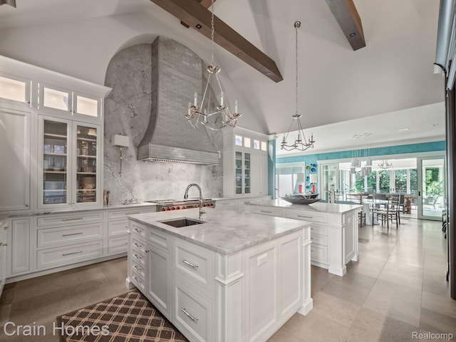 20 Hidden Rdg, Bloomfield Hills, MI 48304 - kitchen with a chandelier, a sink, a center island with sink, high vaulted ceiling, and beamed ceiling