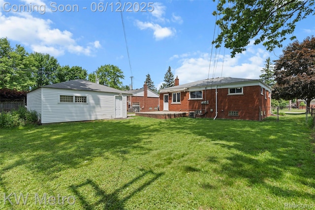 20320 Martin Rd, Saint Clair Shores, MI 48081 - rear view of house with a chimney, brick siding, and an outbuilding