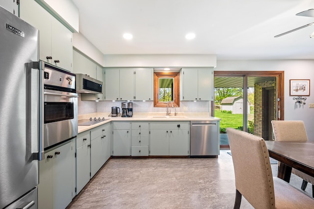 2794 W Park Ln, Benton Harbor, MI 49022 - kitchen featuring stainless steel appliances, a sink, tasteful backsplash, light countertops, and recessed lighting