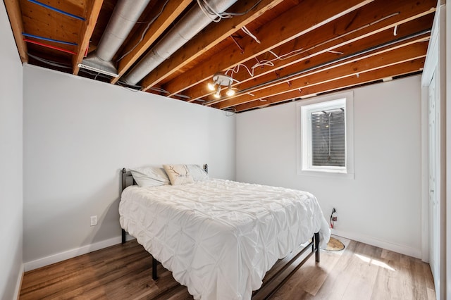 2794 W Park Ln, Benton Harbor, MI 49022 - bedroom with baseboards and wood finished floors