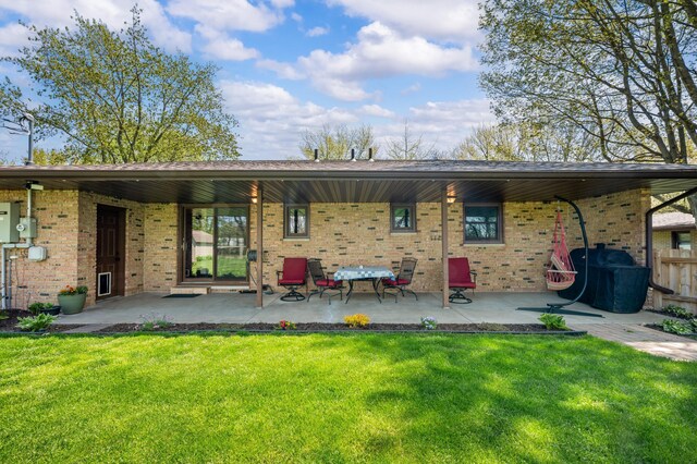 2794 W Park Ln, Benton Harbor, MI 49022 - rear view of house with brick siding and a patio