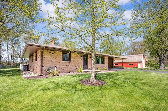 2794 W Park Ln, Benton Harbor, MI 49022 - single story home featuring a chimney, brick siding, driveway, and a front yard