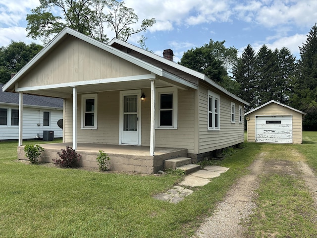 408 Hill St, Buchanan, MI 49107 - bungalow-style home with covered porch, driveway, a chimney, central AC unit, and an outbuilding