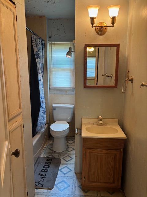 408 Hill St, Buchanan, MI 49107 - bathroom with vanity, toilet, shower / bath combo, and tile patterned floors