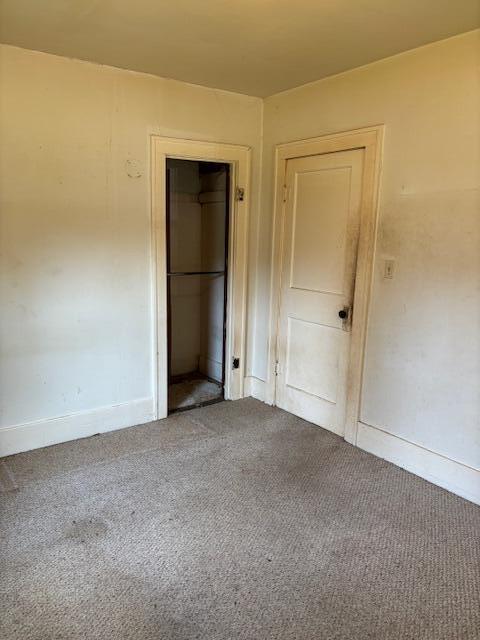 408 Hill St, Buchanan, MI 49107 - unfurnished bedroom with carpet, a closet, and baseboards